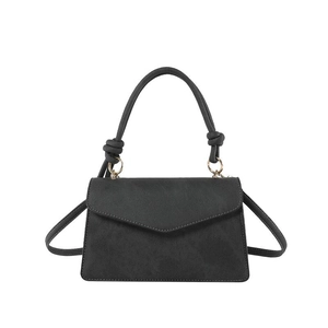 Minimalist black matte leather envelope bag with knot handle and shoulder strap