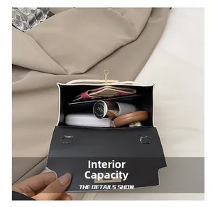 Internal capacity of white stone texture bag showing phone wallet and cosmetics
