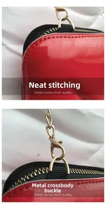 Detail of red glossy leather bag with neat stitching and premium gold metal hooks