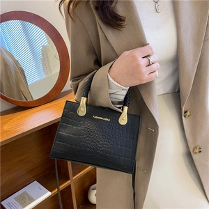 Fashionable black crocodile embossed handbag with woven handle for stylish women