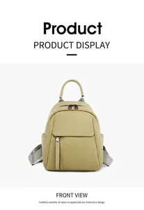 Front view of mint green pebble leather backpack with silver zippers and side pockets