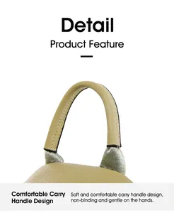 Close-up of olive leather bag handle with reinforced stitching and silver-tone hardware