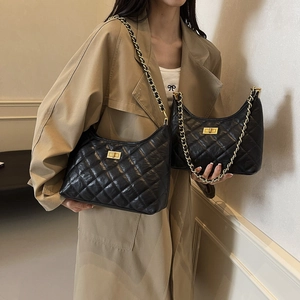 Quilted black leather tote with gold chain strap in large and small sizes