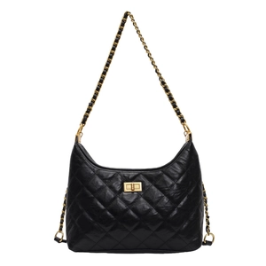 Vintage black quilted hobo bag with gold chain strap and metal turn-lock closure