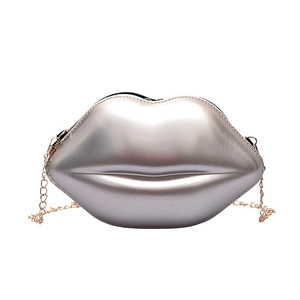 Chic silver lip-shaped crossbody bag with elegant gold chain strap on white background