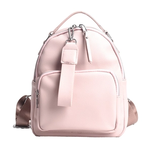 Pale pink faux leather backpack with silver zippers and stylish tan fabric straps