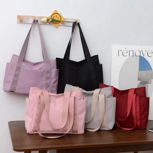 Multi-color nylon tote bags with wide handles and side pockets for daily use