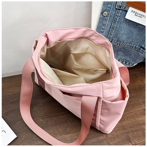 Top view of pink tote bag showing interior lining, zipper pocket and spacious compartments