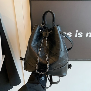 Black quilted leather bucket backpack with drawstring and silver chain details