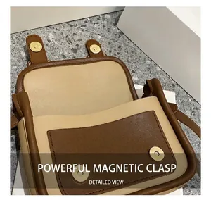 Détail de la fermeture magnétique puissante et des coutures contrastées sur le sac bandoulière