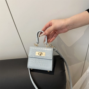 Mini light blue crocodile pattern handbag with gold hardware and shoulder strap