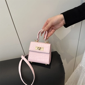 Pink crocodile texture mini handbag with gold clasp and leather shoulder strap