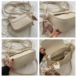 Detailed views of beige crossbody bag interior space and elegant silk scarf accessory