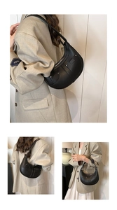 Detailed views of a black crescent shoulder bag featuring pebble grain leather and silver rivets