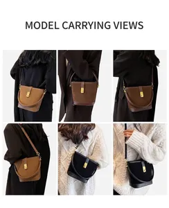 Close-up of matte bucket bag details featuring gold hardware and multiple carrying styles