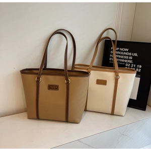 Detailed comparison of brown and cream tote bags showing premium PU leather and stitching