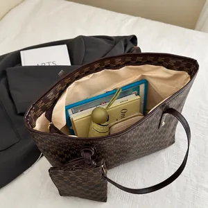 Interior view showing the large capacity and storage of the brown monogram tote bag