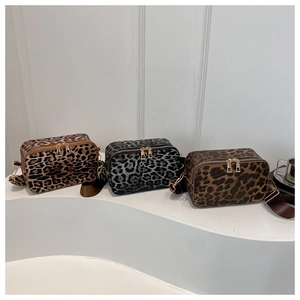Three leopard print crossbody bags in brown, grey, and tan with wide adjustable straps
