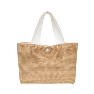 Minimalist straw tote bag with white canvas handles for summer beach vacation