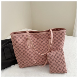 Pink tote bag set with monogram print and matching zipper pouch for daily commute