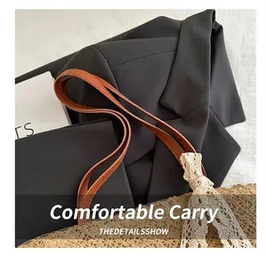 Detail showing high-quality brown leather handle and beige lace bow on summer tote bag