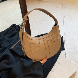 French retro crescent hobo bag in tan lychee grain leather with double rivet pockets