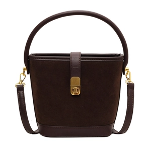 Vintage dark brown suede bucket bag with leather trim and gold metal clasp closure