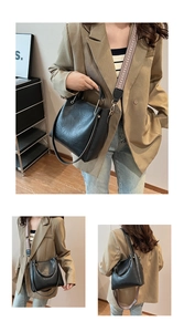Black leather bucket bag detail with geometric jacquard strap and fixed handle for commuting