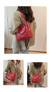 Detail of red bucket bag showing ethnic style woven shoulder strap and metal ring handles