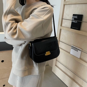 Classic black square leather shoulder bag with gold clasp and slim strap for women