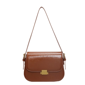 Classic brown glossy leather shoulder bag with vintage gold square clasp on white background