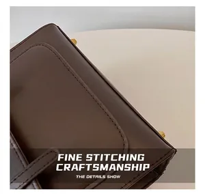 Close-up of precise stitching craftsmanship on the brown leather of the stylish backpack