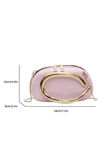 Pink evening clutch bag with gold oval metal handle and chain strap on white background