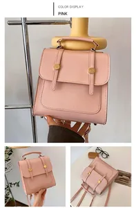 Detail of pink PU leather backpack with gold buckle and magnetic flap closure