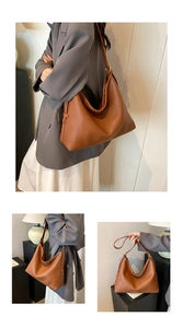 Detail of caramel brown leather tote showing soft texture and gold hardware accents
