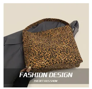 Detail shot of leopard print canvas tote bag showing spacious interior and texture