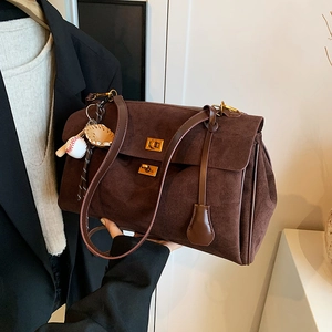 Brown suede large tote bag with gold twist locks and baseball glove charm