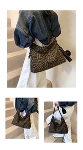 Detail view of fashion leopard print tote bag with black branding label and large capacity