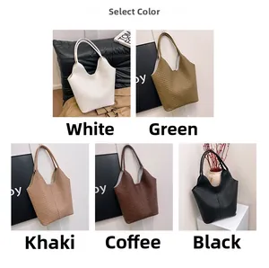 Collage of five woven tote bags in various colors with a stylish V-cut top handle design