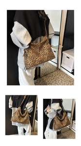 Detail of leopard print tote bag showing thick textured fabric and sleek dark brown straps