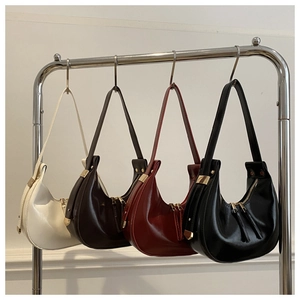 Chic patent leather hobo bags in red, black, white, and brown with gold hardware