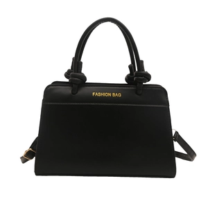 Classic black vintage crossbody bag with knotted handle and gold fashion bag logo