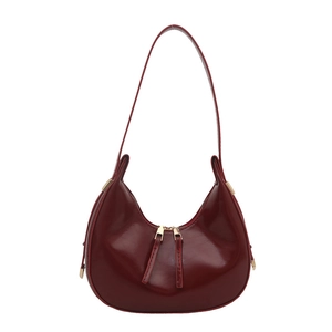Chic burgundy semi-circular patent leather underarm shoulder bag with gold hardware