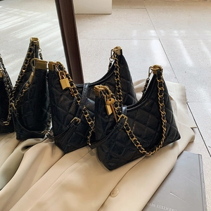 Classic black quilted leather handbags with gold chain straps and vintage lock charms