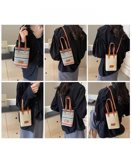 Detail view of woven straw crossbody bags in various colors with model display