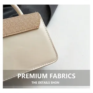 Detailed close-up of cream leather and brown woven texture on a stylish square crossbody bag