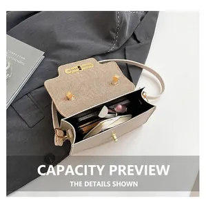 Interior view showing the storage capacity of the cream faux leather crossbody bag