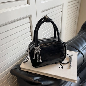 Glossy black embossed chain shoulder bag with silver key charm and woven strap