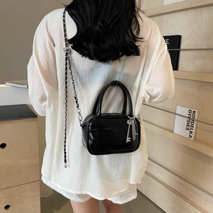 Chic black crocodile pattern crossbody bag with chain strap and silver key pendant