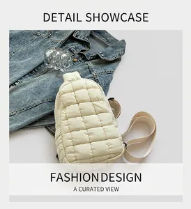 Detail of beige quilted nylon crossbody bag with textured grid and zipper closure